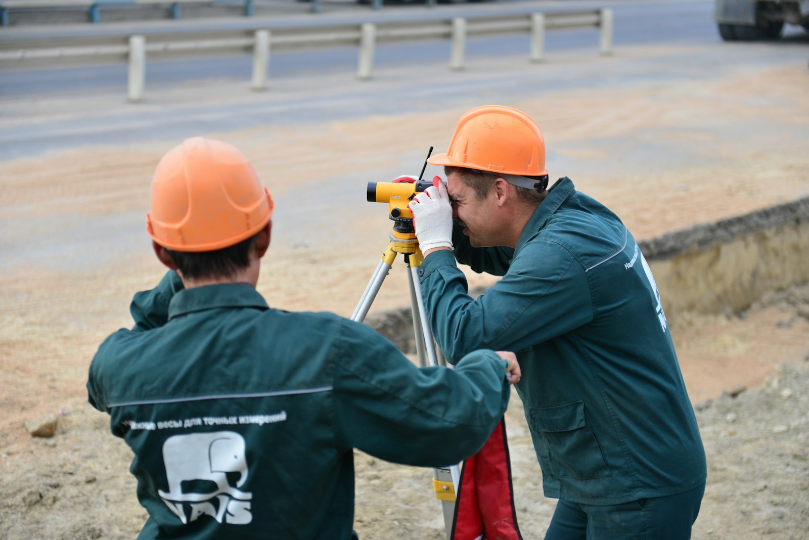 a couple of men standing next to each other, contractors